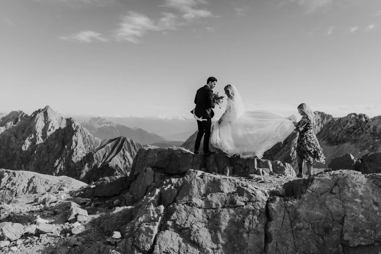 The couple on a rocky ridge near the Zugspitze in dramatic black and white