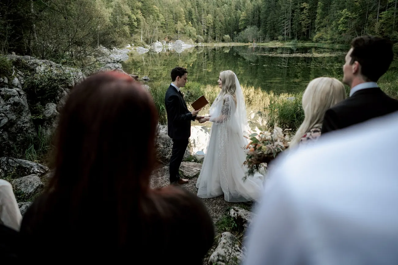 A ceremony at the forested shore of the Eibsee below the Zugspitze