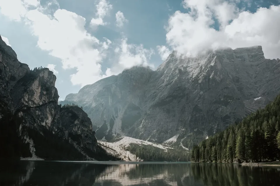 The emerald water and peaks of Lago di Braies at first light