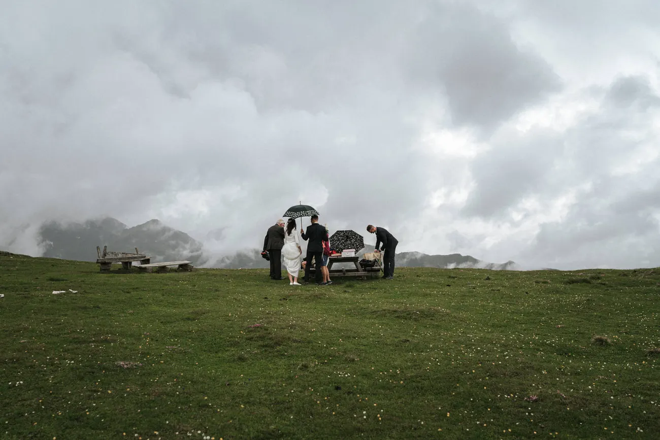 The couple sharing a picnic high on the mountain