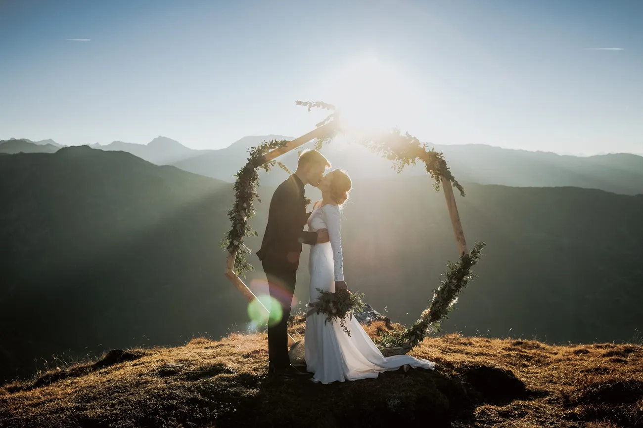 A blazing Tyrolean sunset behind the couple