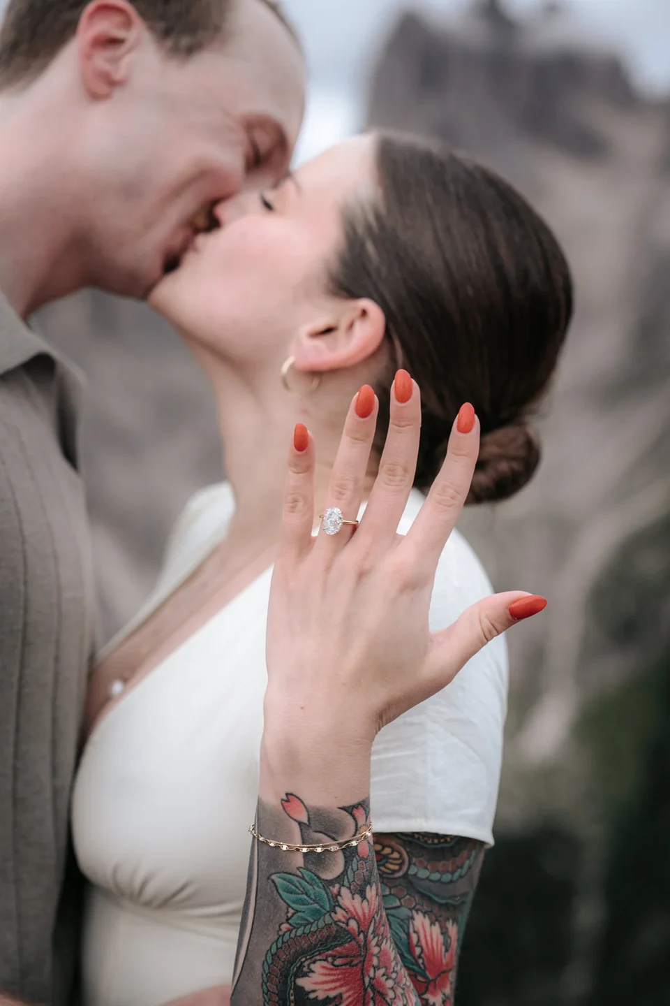 A first kiss as she shows the new ring to the camera