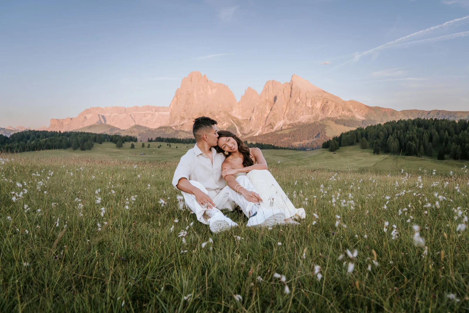 An engagement session glowing in the light on the Seiser Alm