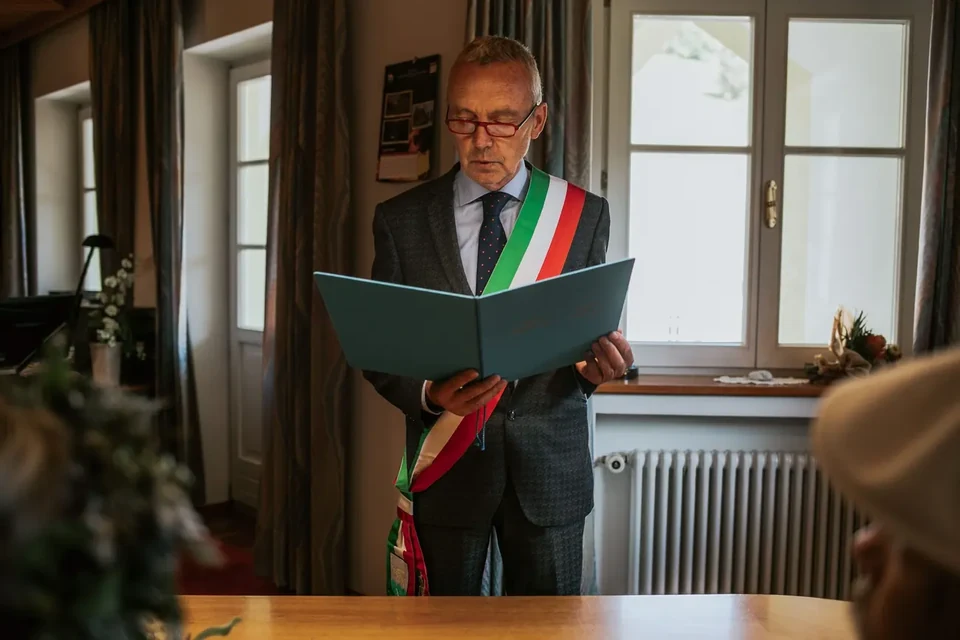 An Italian registrar reading during a civil ceremony