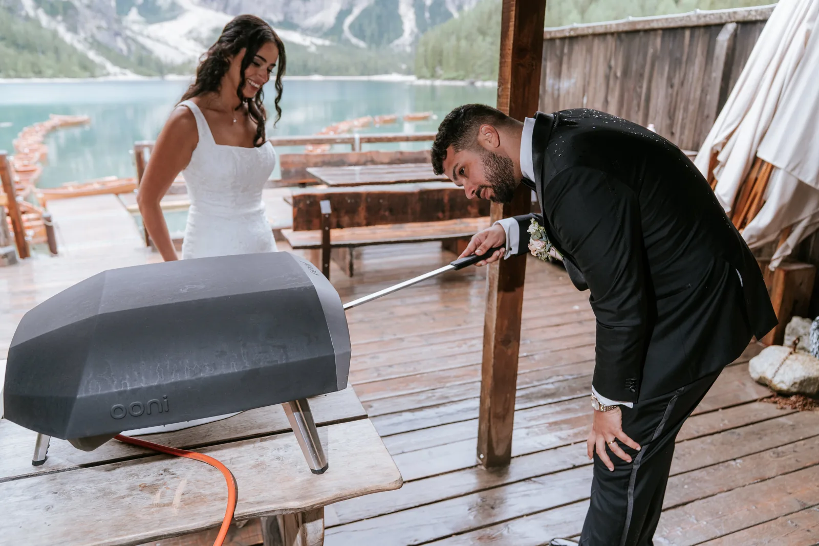 Setting up a portable pizza oven on a mountain meadow