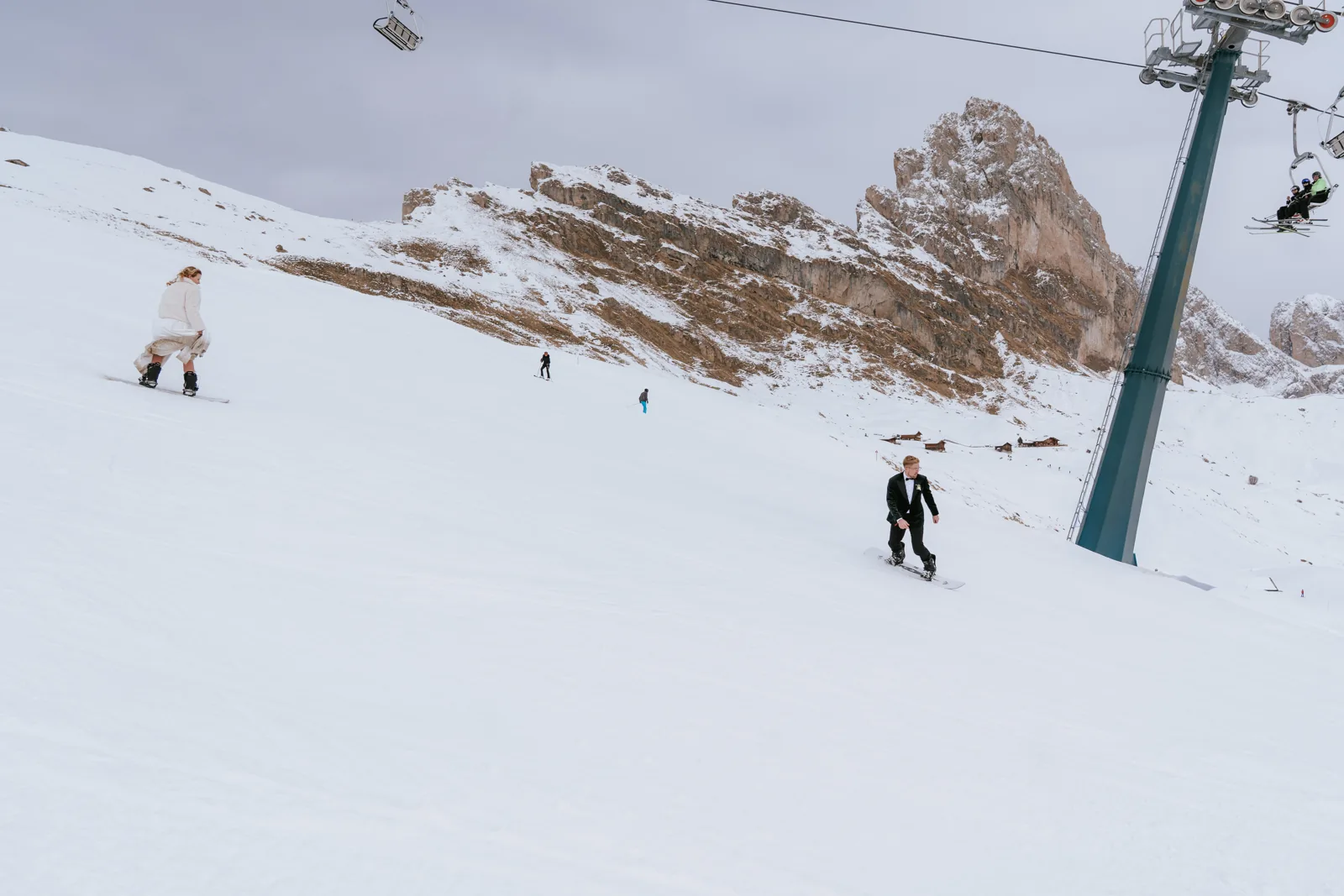 A skier passing in the background during a winter mountain ceremony